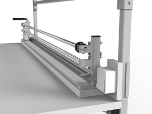 SPR packing table with cutter, rollers, shelves and lighting