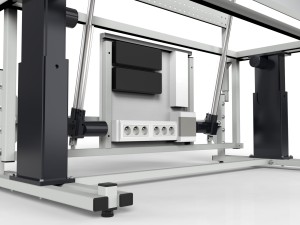 Electrically adjustable table with a tilting top