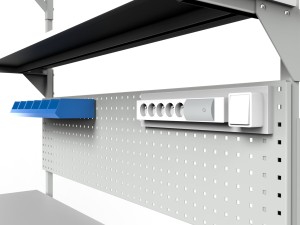 Electrically adjustable table with a tilting top